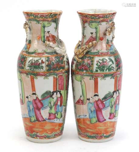 Pair of Chinese Canton porcelain vases with relief dragons, each hand painted in the famile rose