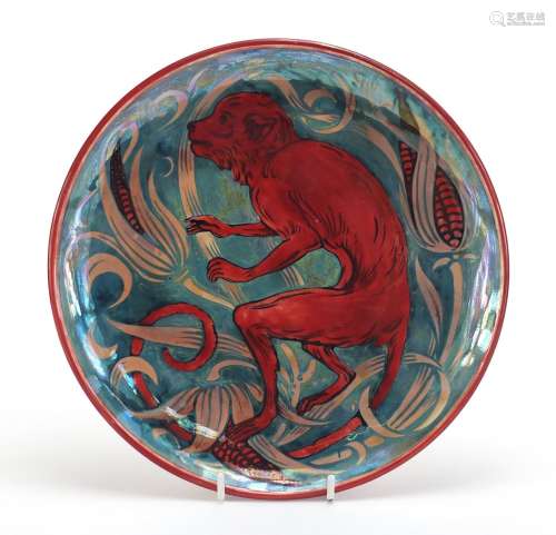 Arts & Crafts lustre pottery plate in the style of William de Morgan, hand painted with a monkey and