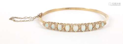 9ct gold opal and diamond bangle, housed in an Oswing & Co box, 6cm in diameter, 9.2g : For