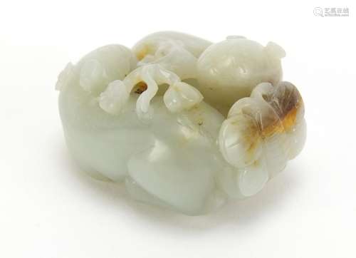 Chinese celadon and russet jade carving of two mythical animals and a butterfly, 5cm wide : For