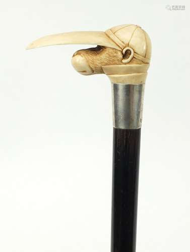 Good ebonised walking stick with carved ivory pommel in the form of a monkey's head wearing a