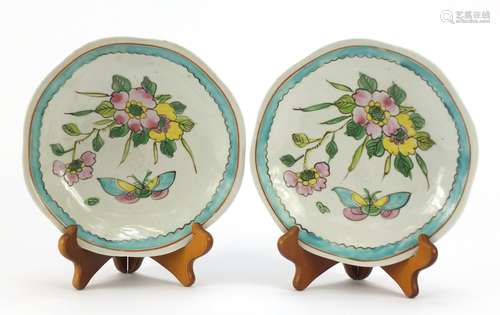 Pair of Chinese porcelain footed plates, hand painted with flowers and butterflies, each 20cm in