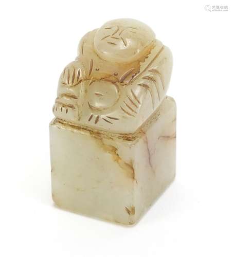 Chinese green and russet jade desk seal carved with a Buddha, 4.3cm high : For Condition Reports