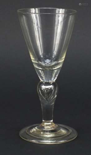 Early 18th century baluster wine glass with trumpet bowl and teared inverted folded foot,