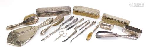 Art Nouveau silver plated vanity metalware, including hand mirror, brushes and hair curlers each