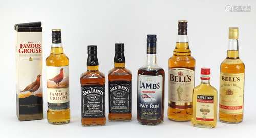 Seven bottles of whiskey and rum including 1L Bells, two bottles of Jack Daniels, The Famous