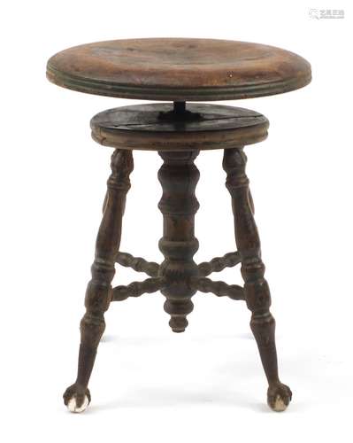 Antique American revolving piano stool on wrought iron, glass claw and ball feet, 48cm high : For