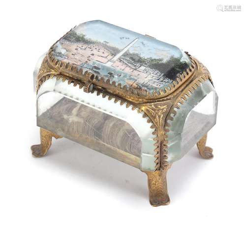 French brass and bevelled glass jewel casket, having a hinged lid decorated with Les Champs Elysees,