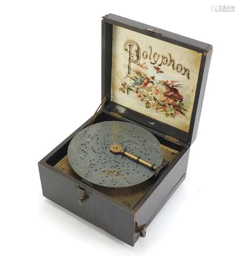 Wooden cased 6 inch polyphone music box with fifteen discs, the top with hand painted floral