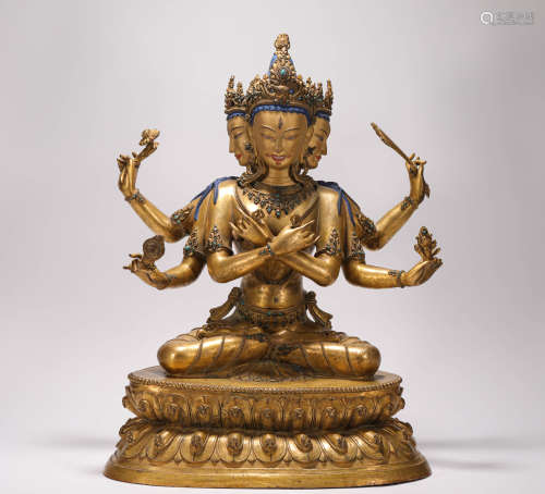 A bronze gilt three-headed six-armed Buddha statue in the Qing Dynasty清代铜鎏金三头六臂佛造像