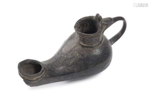 A PERSIAN BRONZE OIL LAMP 17TH CENTURY. LACK.