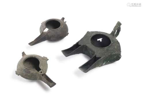 THREE PERSIAN BRONZE OIL LAMPS 12TH-14TH CENTURY