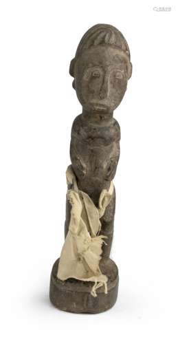 A AFRICAN WOOD SCULPTURE DEPICTING ANCESTOR. 20TH CENTURY.