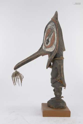 A NEW GUINEA WOODEN SEPIK FIGURE WITH MASK EARLY 20TH CENTURY.