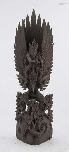 AN INDIAN OR BURMAN WOOD SCULPTURE DEPICTING VISHNU 20TH CENTURY.