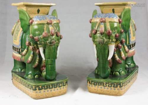 A PAIR OF CHINESE POLYCHROME CERAMIC SEATS DEPICTING ELEPHANTS. 20TH CENTURY.