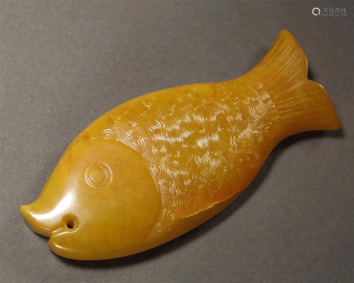 AN ARCHAIC JADE CARVED FISH