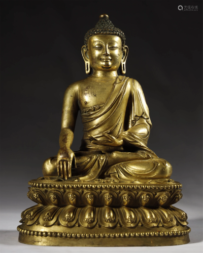 AN ARCHAIC GILT-BRONZE FIGURE OF BUDDHA…