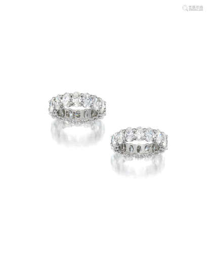 A pair of oval-cut diamond bands