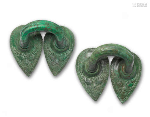 A pair of Etruscan bronze stamnos handles  2