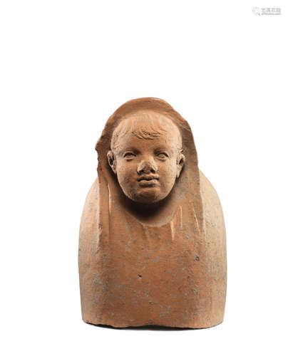 An Etruscan terracotta votive bust of a young boy