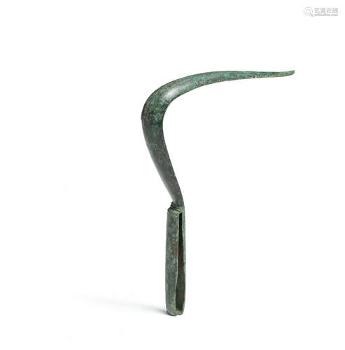 A Roman bronze strigil