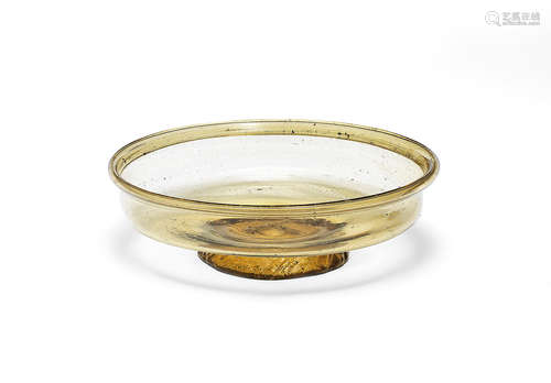 A Roman glass footed bowl