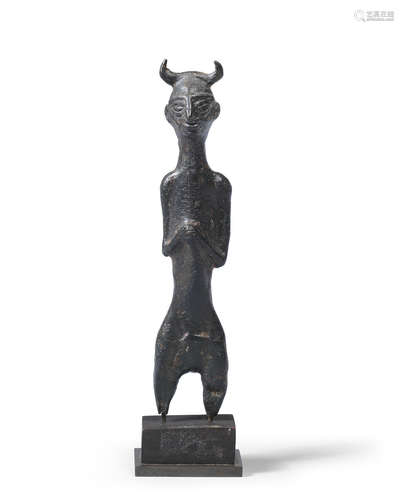 A Luristan bronze horned figure of a god