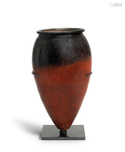 A large Egyptian black-topped pottery jar