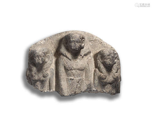 An Egyptian granite triad relief fragment