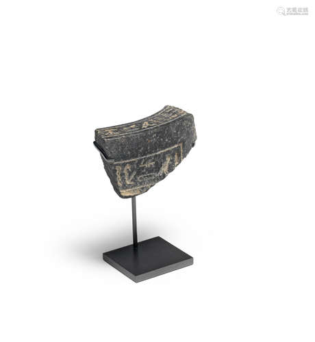 An Egyptian granite vessel fragment with hieroglyphs