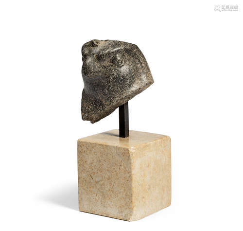 An Egyptian granite head of a falcon