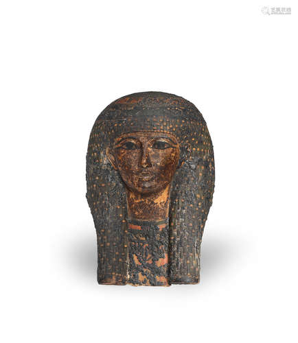 An Egyptian polychrome painted cartonnage mummy mask