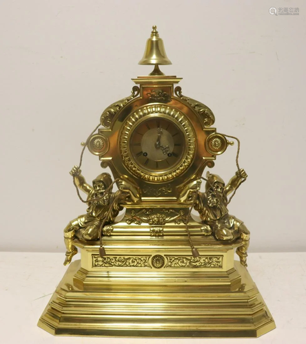 Antique Brass Figural Clock With Bell Finial.