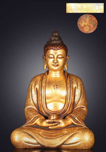 A GILT BROZNE CASTED BUDDHA STATUE