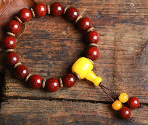 A XIAOYE ZITAN WOOD CARVED BRACELET