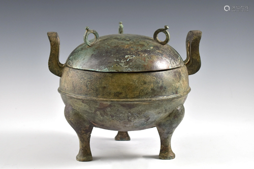 A ANTIQUE BRONZE COVERED TRIPOD CENSER.