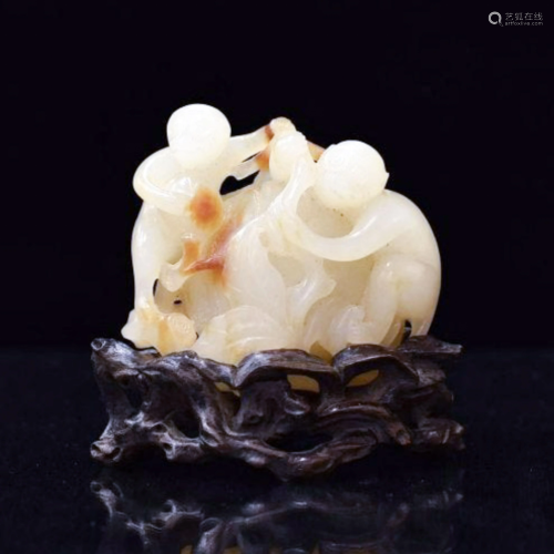 CARVED WHITE JADE OF PEACH AND MONKEYS