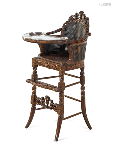 A Rococo Revival Carved Wood High Chair with a Fitted