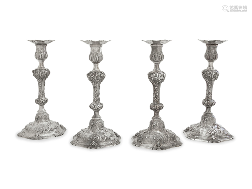 A Set of Four Rococo Revival Silver Candlesticks