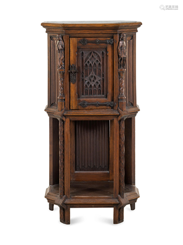 A Gothic Revival Carved Oak Cabinet