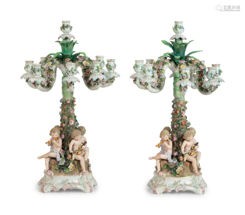 A Pair of Continental Porcelain Figural Candelabra