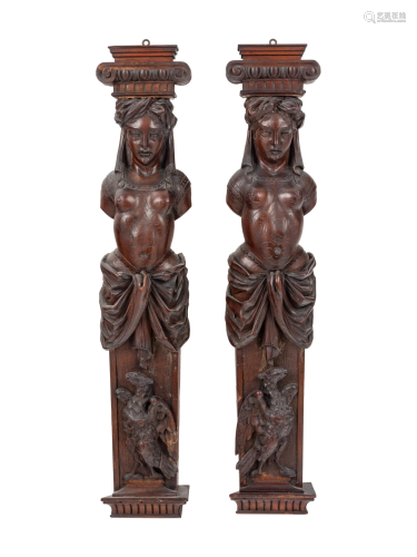 A Pair of French Carved Walnut Figural Ornaments