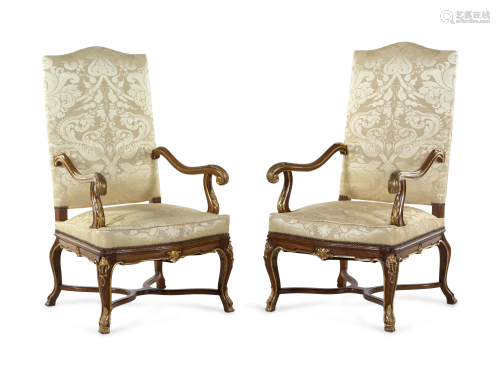A Pair of Louis XV Style Carved and Parcel Gilt Walnut