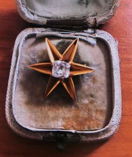 A Victorian diamond set star brooch, set with single old cushion cut diamond, in six point claw