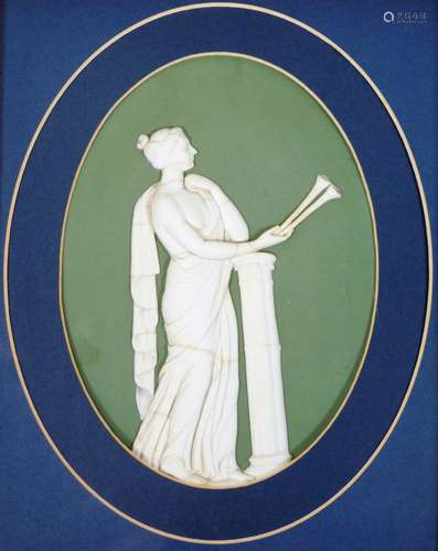 A Wedgwood Jasperware plaque, depicting a female horn player beside a column, in high relief on a