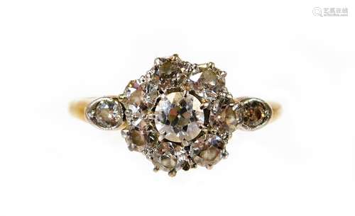 A Victorian diamond daisy ring, set with eight round brilliant cut diamonds to centre, central stone