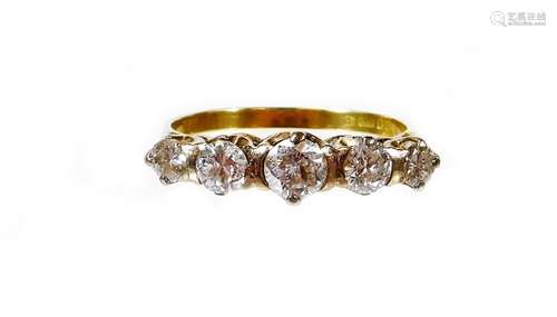 An 18ct gold five stone diamond ring, set with five graduated round brilliant cut diamonds, in a