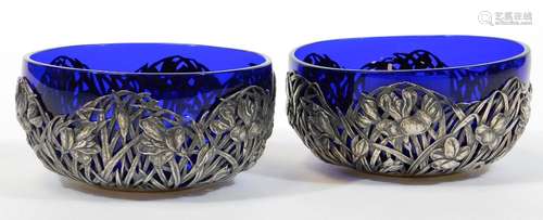 A pair of Chinese Shanghai white metal preserve dishes, by Zeewo, each with blue glass liners of