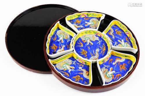 A Japanese lacquer cased sectional hor d'oeuvres dish, 32cm diameter.